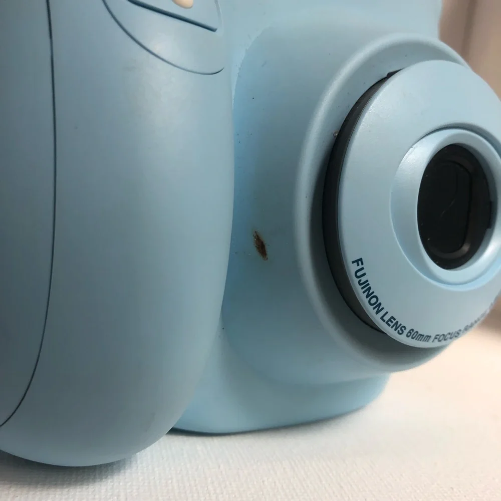 Blue instax mini 7s Polaroid camera
